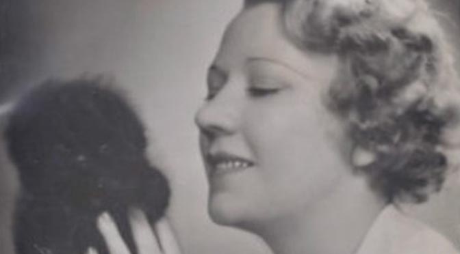 "My Dog Loves Your Dog" featured image. Detail from photograph of Elsie Carlisle holding puppy (mid-1930s).